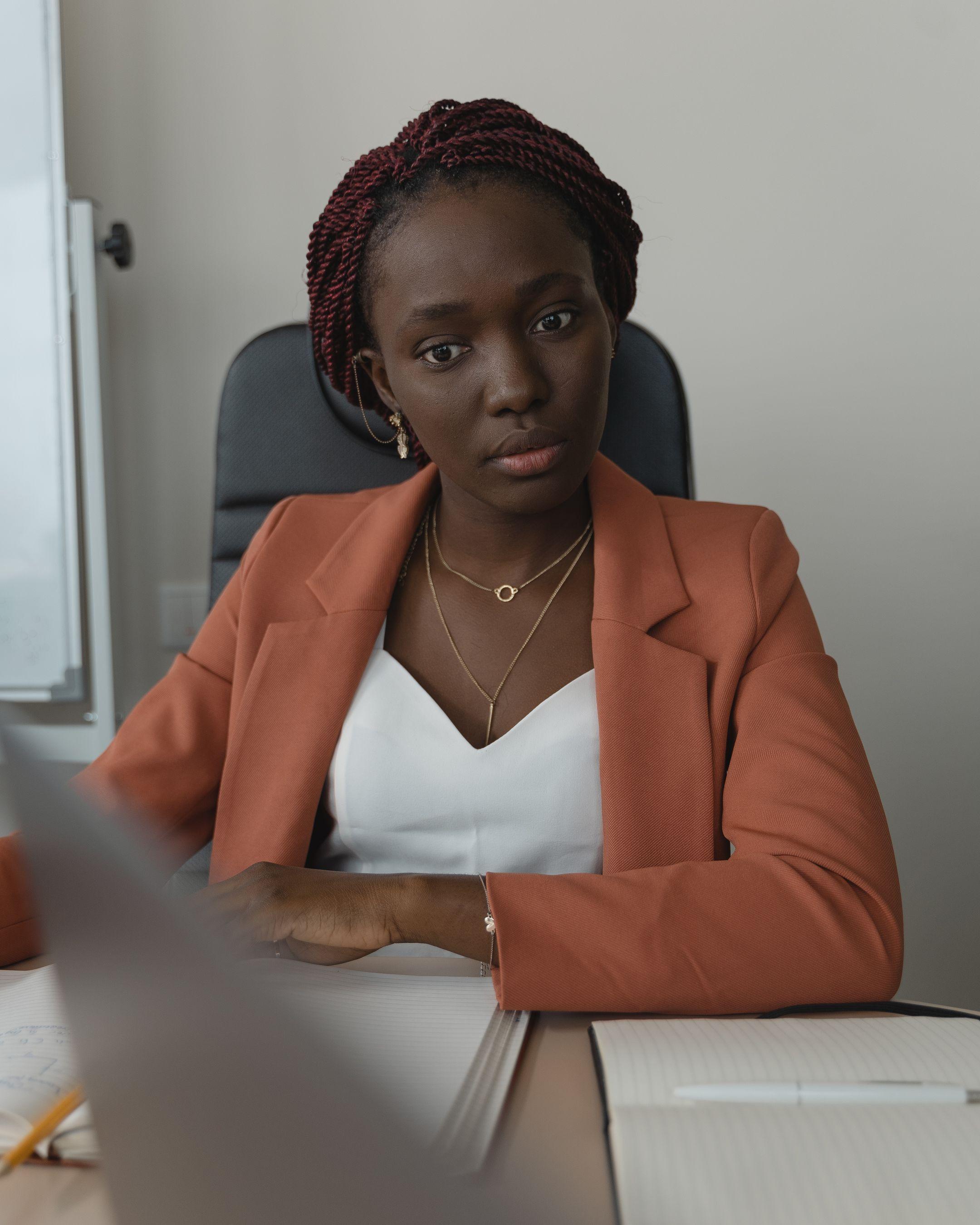 A confident professional reviewing her recruiter-ready CV at her desk